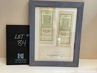 Framed view of the two stock certificates and corporate document from The Warren Ferguson Developing and Mining Company.