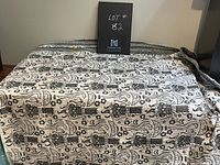 Top view of large Batik fabric spread out on a table showing pattern and texture