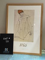 Framed Egon Schiele print showing full artwork with visible signature and title beneath print.