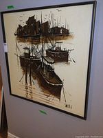 Full view of framed large canvas painting depicting boats at harbor with buildings and seagulls.