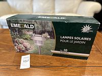 Box labeled 'Emerald' containing 10 solar garden lamps with white light.