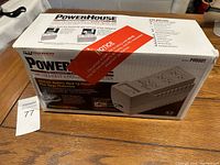 Boxed PowerHouse Computer Backup Supply PH550T with modem protection shown, unopened or partially opened box with warning sticker on top.