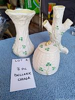 Front angle of all three Belleek porcelain pieces showing shamrock details and lidded dish shape.