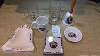 Image showing the full set of Royal collectible dishware and memorabilia including mugs, ashtray, commemorative plaque, bell, and small plate.