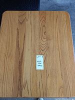 Top view of the wooden side table showing the natural wood grain and rectangular shape.