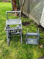 Slide-Trak and Yardworks hose caddies on grass showing overall size and condition.