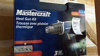 Mastercraft Heat Gun Kit box front showing product image and brand details including 12.5 amp power, model number, and 3 year warranty.