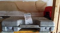 Closed gray molded plastic case labeled socket set with MaxSold auction tag.