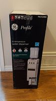 GE Profile tri-temperature water dispenser box front view showing model PXCF22RBS and product features