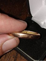 Close-up of the gold hallmark stamp on the scarf clip showing 9k and Birmingham markings