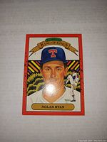 Close-up of the Nolan Ryan Donruss Diamond Kings baseball card showing the illustrated portrait with Donruss King of Kings graphic and Texas Rangers cap.