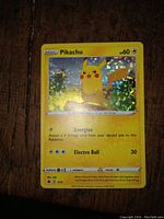 Front side of the holographic Pikachu Pokémon card showing image, text, and stats.