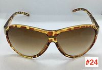 Front view of Foster Grant sunglasses showing tortoiseshell patterned frames and gradient lenses