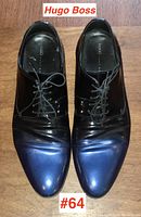 Top-down view of both Hugo Boss men's dress shoes showing two-tone black and dark blue design with laces tied.