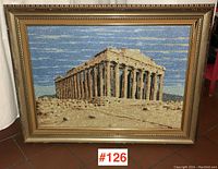 Front view of large framed needlework showing the Parthenon in daylight with visible bead embellishments and ornate gold-tone frame.