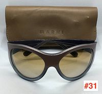 Front view of MARNI sunglasses with original soft case behind