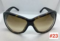 Front view of Ralph Lauren tortoiseshell sunglasses showing large square gradient brown lenses and frame shape.