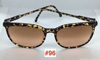 Front view showing full tortoise shell frame with brown lenses marked #96