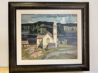 Framed giclée print showing the stylized church with a tower and steeple, rocky landscape and trees, muted colors.