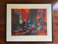 Framed limited edition print of colorful abstract painting by Marcel Mouly with white mat and black frame showing minor scuff marks.