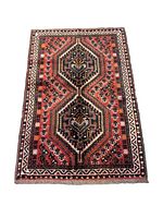 Full view of the Persian Shiraz tribal rug showing overall geometric pattern and color scheme.