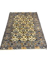 Full top view of rug on floor showing overall pattern and condition