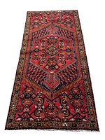 Full laid out view of the rug showing central geometric medallion and border patterns.