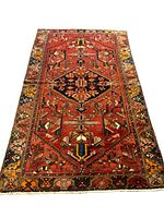 Full view of Persian Zanjan rug with visible central geometric medallion and surrounding floral/architectural edge patterns.