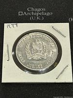 Front side of the 1977 Ontario Queen Elizabeth II Silver Jubilee aluminum token with crown, date, and inscriptions.