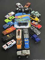Photo of lot showing 20 die cast model vehicles of various types and colors, including sports cars, classic cars, and trucks.