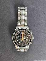 Front view of Breil chronograph diver watch with black dial and bezel, showing luminous hands and subdials with depth meter indicators.