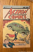 Front cover of 1938 Action Comics No. 1 featuring Superman lifting a car.