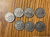 Seven Canadian 5 cent nickels dated 1947 showing beaver design on reverse side.