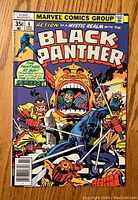 Front cover with Black Panther in dynamic battle scene with warriors and mystic elements.
