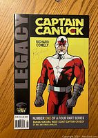Front cover of Captain Canuck number one comic featuring character in red and white costume, signed by Richard Comely.
