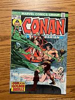 Front cover of Conan the Barbarian issue #37 showing the main character fighting a green creature, with title and Marvel Comics Group logo.