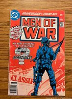 Front cover of Men Of War #1 featuring Gravedigger and Enemy Ace with classified U.S. Army personnel file theme.