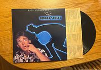 Front cover of Paul McCartney vinyl record album 'Give My Regards to Broad Street' with black vinyl partially visible inside cover