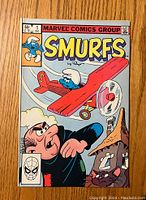 Front cover of Smurfs #1 comic book showing colorful artwork with Smurfs characters and Gargamel.