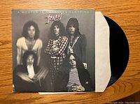 Front cover of Sparks vinyl record "A Woofer in Tweeter's Clothing" showing blurred effect photo of band members.