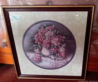 Framed floral art print showing full frame and artwork, highlighting gold edge and cherry wood frame with a floral vase inside.