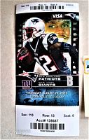 Front view of the vintage 2013 New England Patriots vs New York Giants game ticket, displaying player imagery and game information.
