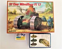 Boxes of two vintage Char Mitrailleur FT 17 military tank model kits with colorful illustrated artwork showing camouflaged tank and soldiers in a battlefield setting.
