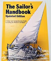 Front cover showing title and sailing boat illustration on yellow background.