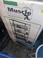 Original box for Muscle Rack heavy duty steel shelving unit showing product image and branding.