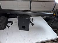 Full view of the black ONN soundbar and subwoofer placed on a white table, showing the size and condition including surface scratches.