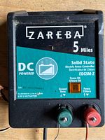 Close-up of the front label showing brand, power specs, and model number.