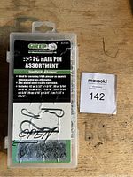 Closed plastic box showing label and quantity of 150 piece assortment of hair pins by Grip labeled as model 43140.