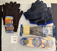 All items displayed on a table including gloves and shoe inserts