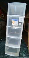 Front view of five drawer plastic storage bin with clear drawers